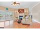 Spacious living room features a fireplace, ceiling fan, and lots of natural light at 643 Old Greenville Rd, Fayetteville, GA 30215