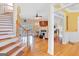 Cozy living room with hardwood floors, fireplace, and staircase access at 643 Old Greenville Rd, Fayetteville, GA 30215