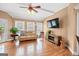 Bright living room with hardwood floors, tray ceiling, and natural light through windowed doorway at 643 Old Greenville Rd, Fayetteville, GA 30215