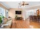 Open-concept living room with hardwood floors, recessed lighting, and a view to the kitchen at 643 Old Greenville Rd, Fayetteville, GA 30215
