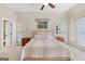 Large main bedroom with plush carpet, ceiling fan, and picture frame decor at 643 Old Greenville Rd, Fayetteville, GA 30215