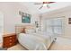 Large main bedroom with plush carpet, ceiling fan, and picture frame decor at 643 Old Greenville Rd, Fayetteville, GA 30215