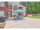 Outdoor patio with a table and chairs, perfect for entertaining guests and enjoying the backyard views at 643 Old Greenville Rd, Fayetteville, GA 30215