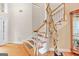 Elegant staircase with hardwood steps and unique decorative tree at 643 Old Greenville Rd, Fayetteville, GA 30215