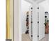 Organized walk-in closet with shelving, carpeted floor, and double doors at 643 Old Greenville Rd, Fayetteville, GA 30215