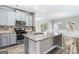 Beautiful kitchen with gray cabinetry, granite countertops, stainless steel appliances at 2466 Bear Mountain St, Lithonia, GA 30058