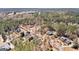 A neighborhood aerial shot showcasing winding streets, mature trees and manicured lawns at 300 Tarragon Dr, Fayetteville, GA 30215
