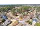 Aerial view of a residential neighborhood with mature trees and well-manicured lawns at 300 Tarragon Dr, Fayetteville, GA 30215