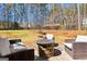 Cozy backyard with fire pit and stone water feature creating a relaxing outdoor retreat at 300 Tarragon Dr, Fayetteville, GA 30215