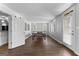 Spacious basement area featuring a ping pong table, hardwood floors, and natural light from the windows at 300 Tarragon Dr, Fayetteville, GA 30215