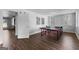 Basement game room with modern design, windows, ping pong table, and plank flooring at 300 Tarragon Dr, Fayetteville, GA 30215