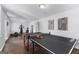 Finished basement area with ping pong table, exercise equipment and durable, stylish flooring at 300 Tarragon Dr, Fayetteville, GA 30215