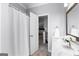 Bathroom with a shower featuring dual sinks at 300 Tarragon Dr, Fayetteville, GA 30215