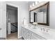 Bright bathroom featuring a dual sink vanity, and neutral-colored walls at 300 Tarragon Dr, Fayetteville, GA 30215
