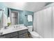 Bathroom featuring vanity with sink, shower with white curtain, and neutral walls at 300 Tarragon Dr, Fayetteville, GA 30215