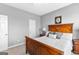Bedroom featuring a wooden bed frame with plush pillows and neutral gray walls at 300 Tarragon Dr, Fayetteville, GA 30215