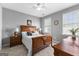 Bedroom with natural light, two windows, a ceiling fan, and wooden bedroom furniture at 300 Tarragon Dr, Fayetteville, GA 30215