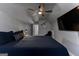 Cozy bedroom featuring a ceiling fan, a TV, and carpeted floors at 300 Tarragon Dr, Fayetteville, GA 30215