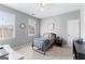 Well-lit bedroom featuring a large window, and neutral colored walls at 300 Tarragon Dr, Fayetteville, GA 30215