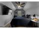 Bedroom with sloped ceiling, tv, ceiling fan, and cozy decor with neutral walls at 300 Tarragon Dr, Fayetteville, GA 30215