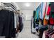 Walk-in closet featuring ample storage with shelving and hanging racks at 300 Tarragon Dr, Fayetteville, GA 30215