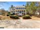 Traditional two-story home featuring a double front porch, gray shutters and mature landscaping at 300 Tarragon Dr, Fayetteville, GA 30215