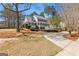 Traditional two-story home featuring a double front porch, gray shutters and mature landscaping at 300 Tarragon Dr, Fayetteville, GA 30215