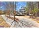 Charming two-story home with a spacious double porch, nestled among mature trees and landscaping at 300 Tarragon Dr, Fayetteville, GA 30215