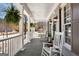 Charming front porch with rocking chairs and stylish decor create a welcoming outdoor space at 300 Tarragon Dr, Fayetteville, GA 30215