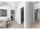 Hallway leading to a bonus room, closet, and another room with neutral walls and carpet at 300 Tarragon Dr, Fayetteville, GA 30215