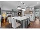 Gourmet kitchen with a large island, modern appliances, and a view to the living room at 300 Tarragon Dr, Fayetteville, GA 30215