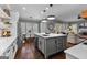 Spacious kitchen with stainless steel appliances, gray cabinets, and a large center island at 300 Tarragon Dr, Fayetteville, GA 30215