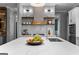 Luxurious kitchen with a large island, modern faucet, and stylish design elements at 300 Tarragon Dr, Fayetteville, GA 30215