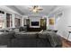 Large living room with a grey sofa, tv, and built-in display cabinets at 300 Tarragon Dr, Fayetteville, GA 30215