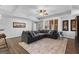 Spacious living room with ample seating, natural light, and stylish decor at 300 Tarragon Dr, Fayetteville, GA 30215