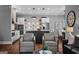 Living room with hardwood floors, kitchen view, stylish chairs, and a leather couch at 300 Tarragon Dr, Fayetteville, GA 30215