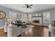 A spacious living room with hardwood floors, a fireplace, and comfortable seating with stylish decor at 300 Tarragon Dr, Fayetteville, GA 30215