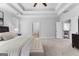 Spacious bedroom featuring a ceiling fan and a bed with doorways leading to other rooms at 300 Tarragon Dr, Fayetteville, GA 30215