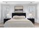 Bright bedroom with a decorative painting hanging over a bed with 2 nightstands and 2 windows at 300 Tarragon Dr, Fayetteville, GA 30215
