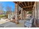 Covered outdoor area with brick columns and patio seating, great for relaxing at 300 Tarragon Dr, Fayetteville, GA 30215