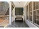 Inviting porch with ceiling fan and privacy screens offers a comfortable outdoor living space at 300 Tarragon Dr, Fayetteville, GA 30215