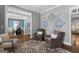 Inviting sitting room with hardwood floors, comfortable seating and stylish decor, perfect for relaxation at 300 Tarragon Dr, Fayetteville, GA 30215