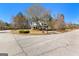 Suburban home on corner lot with circular drive and lush landscaping at 300 Tarragon Dr, Fayetteville, GA 30215