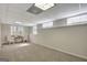 Spacious basement with natural light, carpeting, and ample room for activities at 140 Rockglen Ct, Fayetteville, GA 30215
