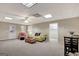 This large finished basement features carpet, neutral walls, and an adjoining room at 140 Rockglen Ct, Fayetteville, GA 30215