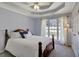 This bedroom features a window, neutral paint, a ceiling fan, and carpet at 140 Rockglen Ct, Fayetteville, GA 30215