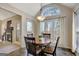 Inviting dining area features a round table, large windows, and natural light at 140 Rockglen Ct, Fayetteville, GA 30215