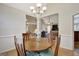 Open dining room showcases modern lighting and easy access to living spaces at 140 Rockglen Ct, Fayetteville, GA 30215