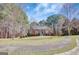 Inviting home with a well-maintained lawn, brick accents, and a neatly landscaped front yard at 140 Rockglen Ct, Fayetteville, GA 30215