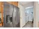 This kitchen has a black refrigerator and a doorway to the laundry room at 140 Rockglen Ct, Fayetteville, GA 30215